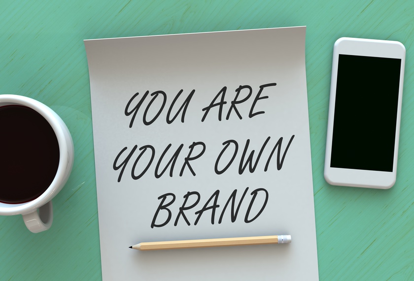 You Are Your Own Brand, message on paper, smart phone and coffee on table